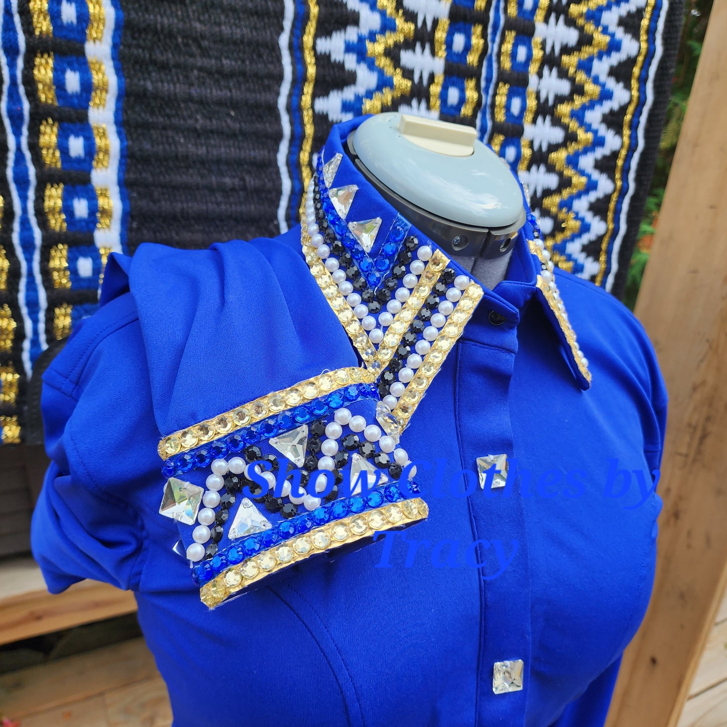 A Lg/XL Blue & Gold vest, shirt, & pad set